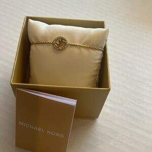 NWT Michael Kors adjustable gold bracelet with Michael Kors logo with crystals